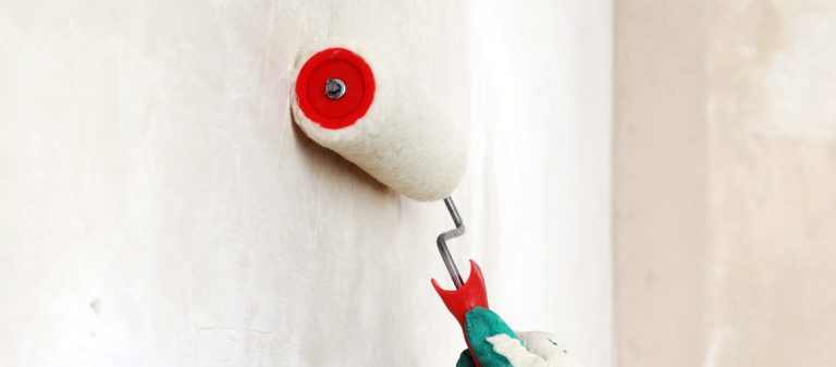 Painting an undercoat on a wall