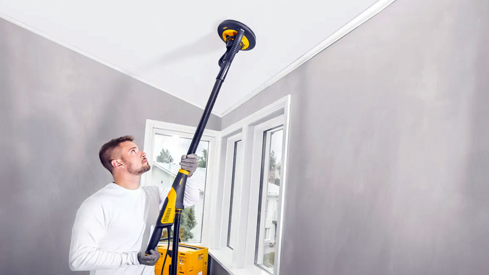 Removing paint with an orbital sander