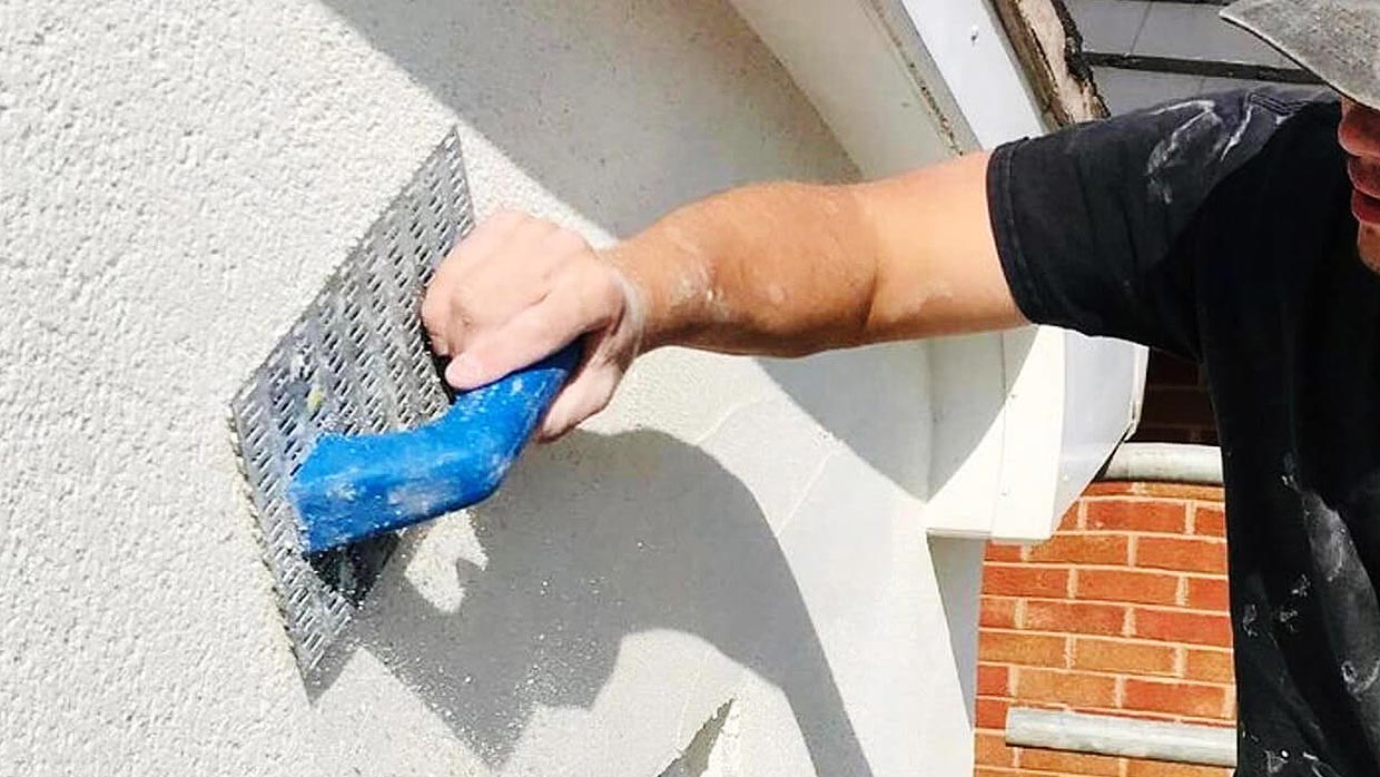 Applying an external wall coating on a house